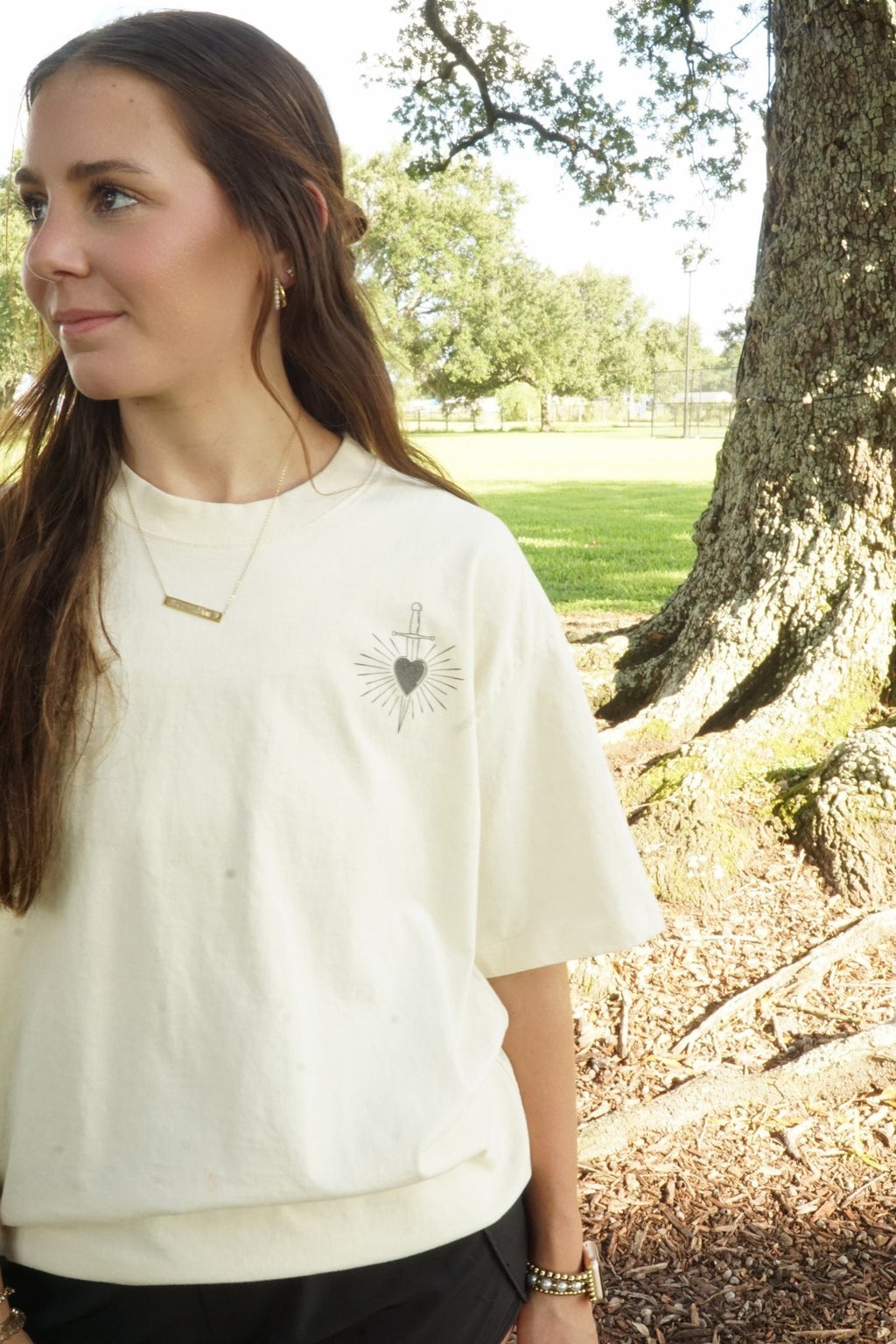 Stone heavyweight tee worn outdoors, chest mark