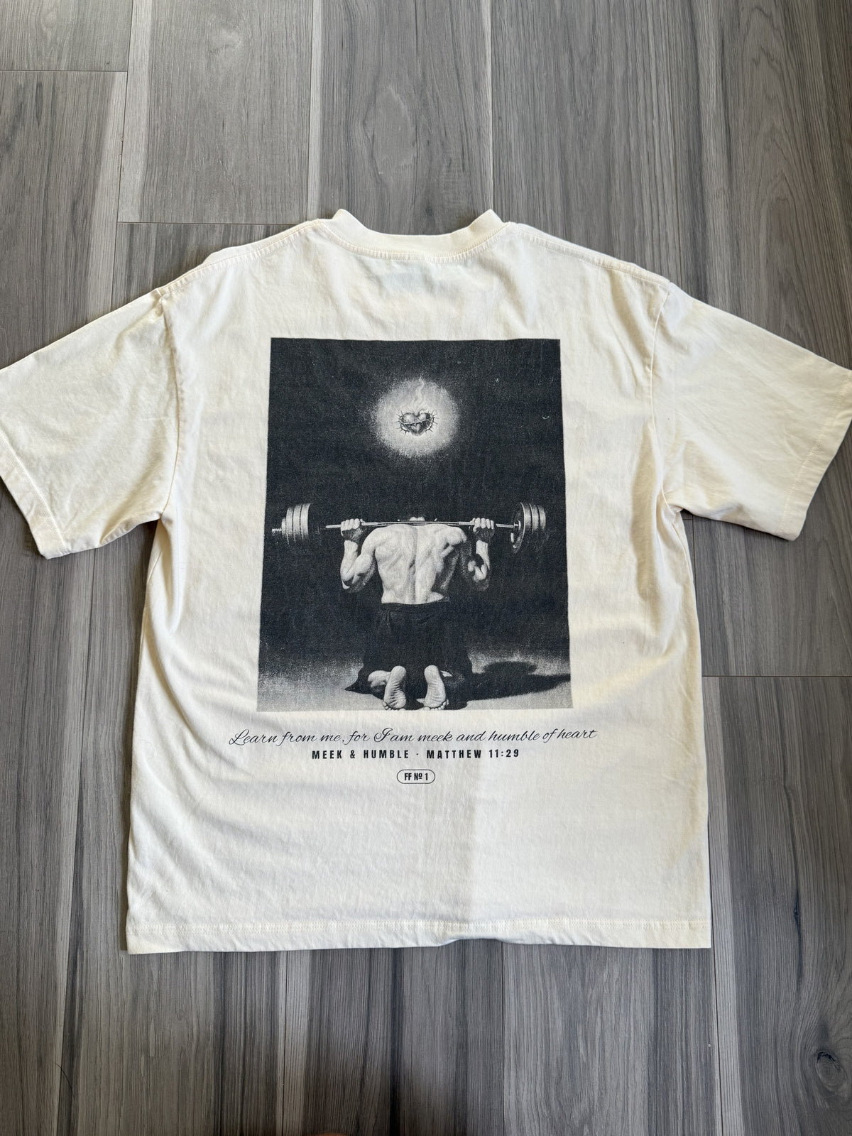 Meek and Humble back print, apricot tee, flat lay